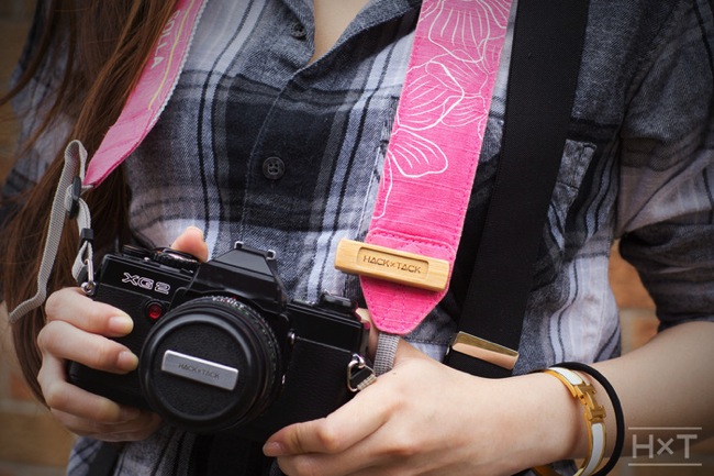 Magnetic camera lens cap holder